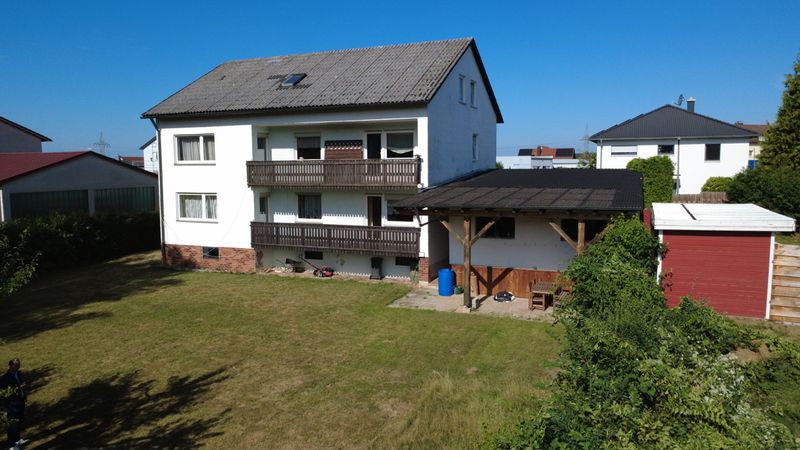 Großzügiges Dreifamilienhaus mit Garten und vielseitigen Nutzungsmöglichkeiten in ruhiger Wohnlage